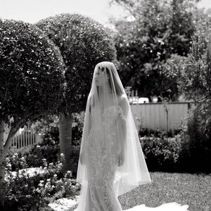 Solid white cathedral style tulle veil with blusher